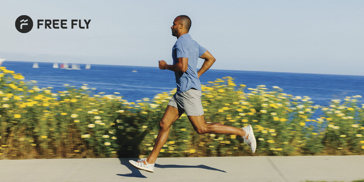 Man running outdoors in Free Fly performance clothing.